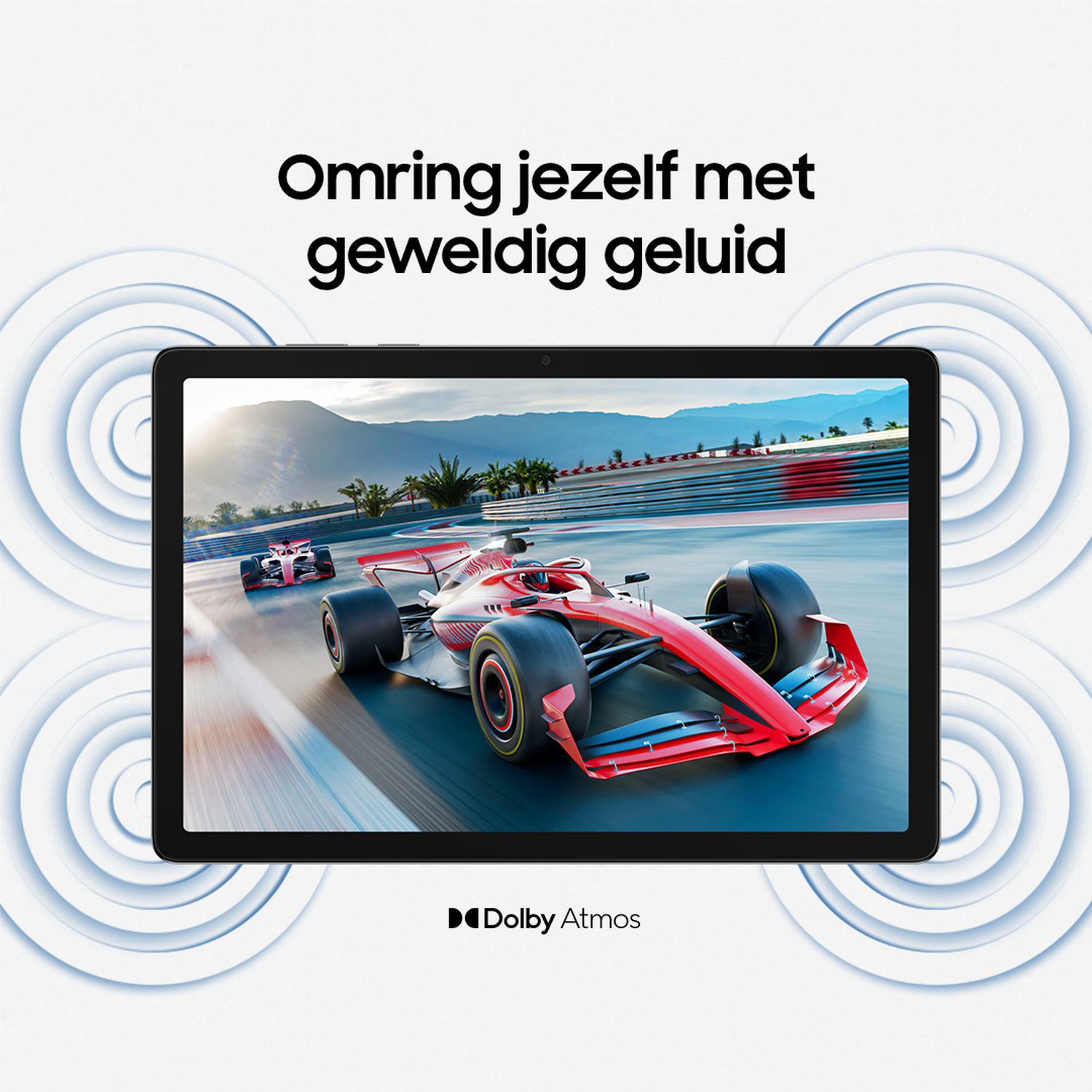Tablet displaying a race car on a track. The car is red and white. Mountains and palm trees are visible in the background.