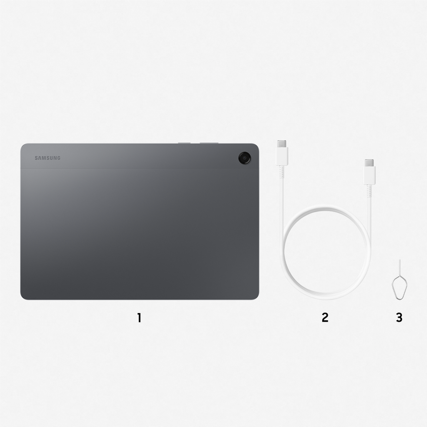 A gray tablet, white USB-C cable, and SIM ejector tool are on a white surface. The tablet has 'SAMSUNG' on it.