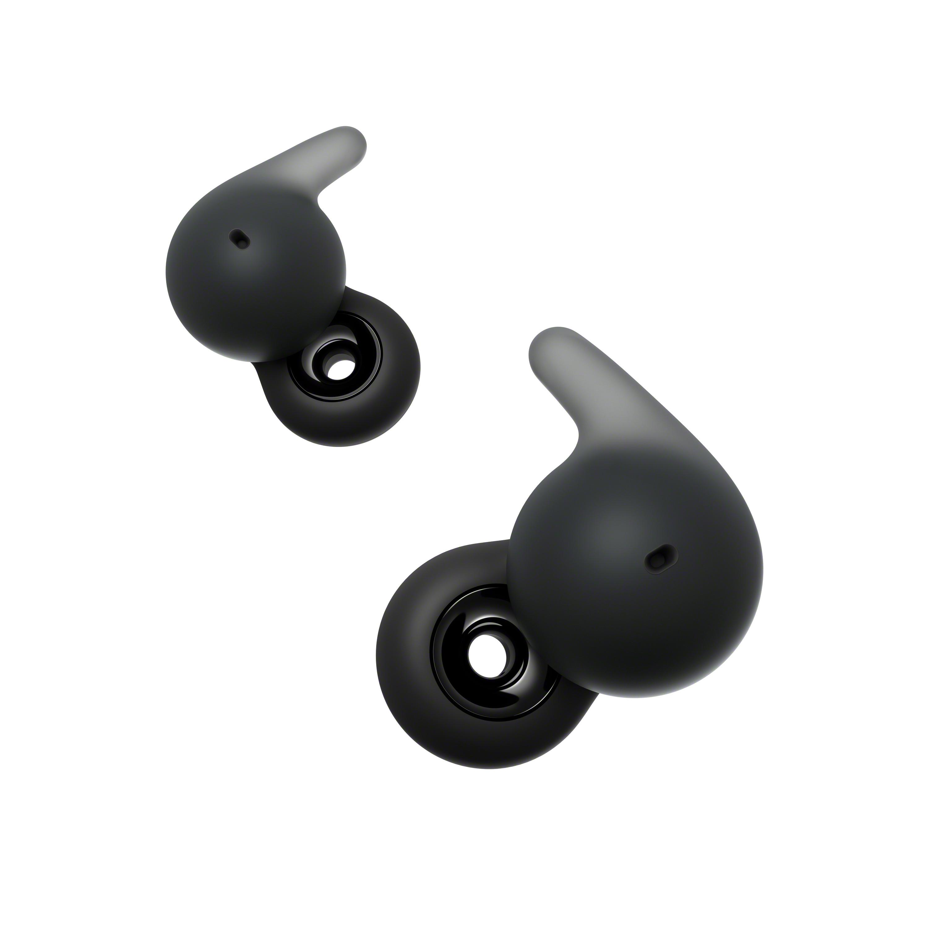 Dos auriculares negros sobre fondo blanco. Cada uno tiene un cuerpo redondeado y una punta de silicona. Las puntas son grises.
