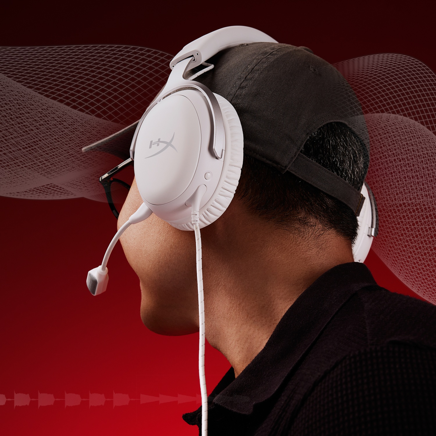 A person wearing a white headset with a microphone. The background is red with white graphic elements. The person wears a cap.