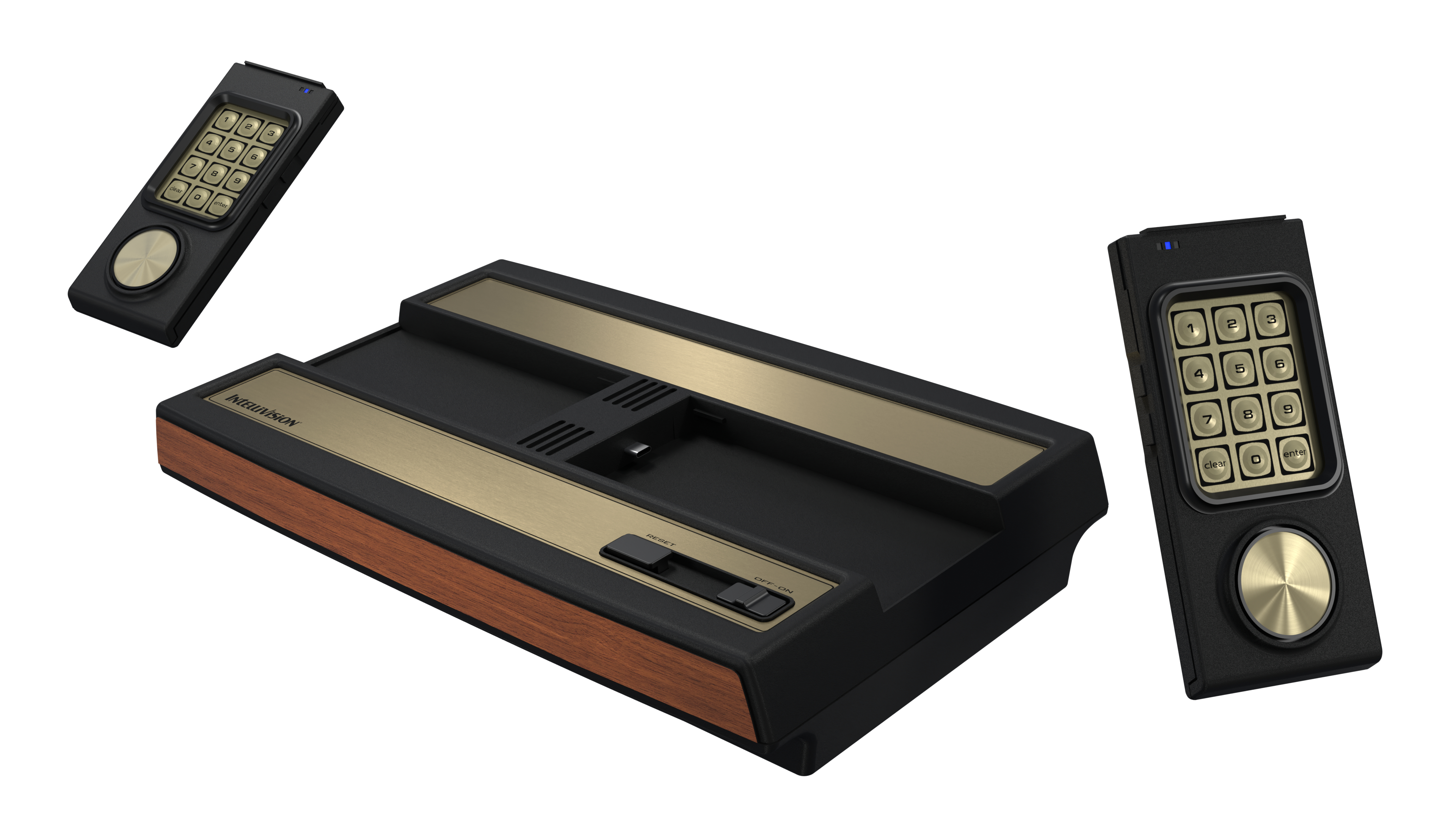 Eine Intellivision-Spielkonsole mit zwei Controllern. Konsole ist schwarz mit goldenen Akzenten und Holzverkleidung. Controller sind schwarz mit Ziffernblöcken.