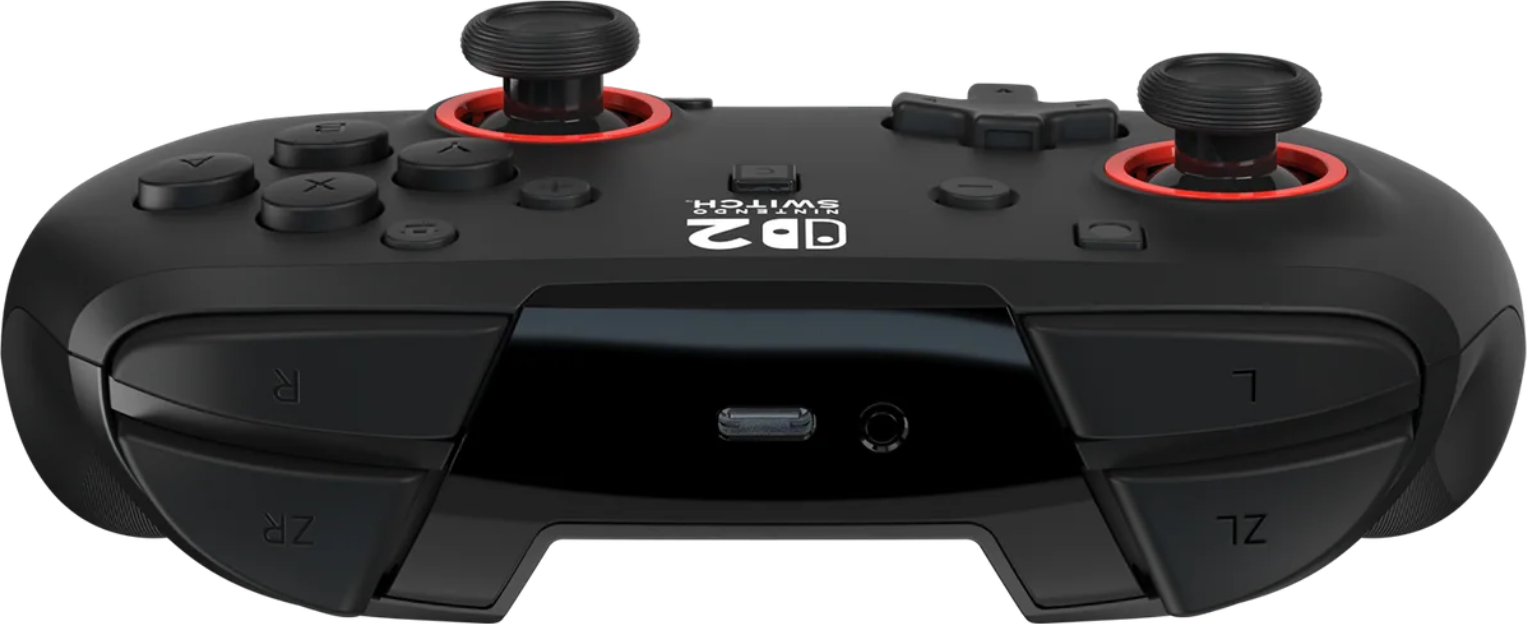 Schwarzer Nintendo Switch-Controller. Merkmale sind Tasten, Joysticks mit roten Akzenten und eine zentrale Platte mit Anschlüssen.