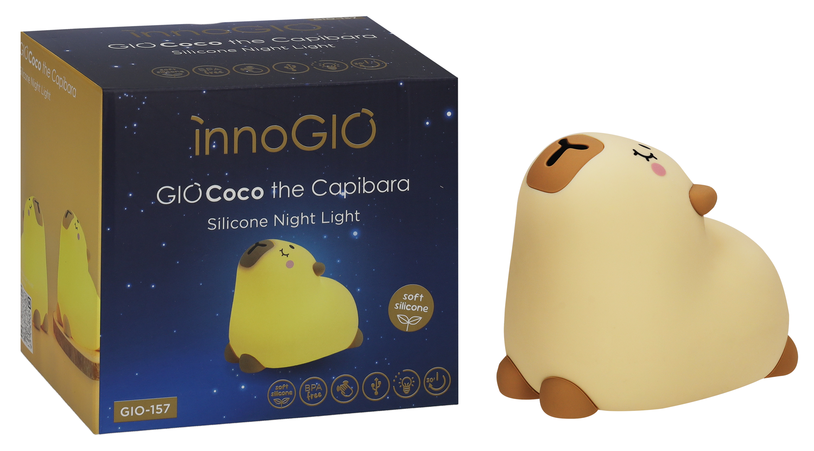 Nocna lampka w kształcie kapibary z pudełkiem. Światło jest żółte z brązowymi detalami. Pudełko ma tekst i obraz.