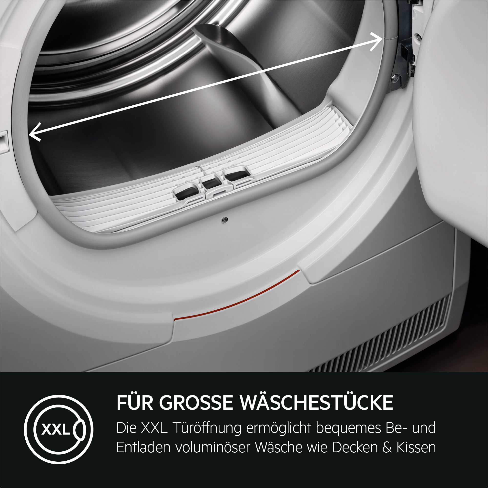 Nahaufnahme einer weißen Trocknertür mit großer Öffnung. Text: Für große Wäschestücke.