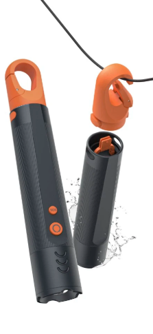 Pomarańczowo-czarne urządzenie, częściowo zdemontowane, z rozpryskami wody. Zawiera hak, korpus główny i odłączony fragment.