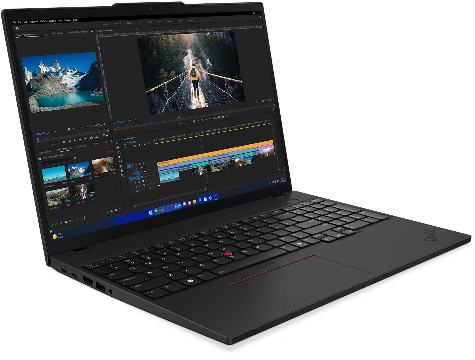 Fekete laptop videószerkesztő szoftverrel. A képernyőn egy személy látható egy hídon. A billentyűzet fókuszban van.