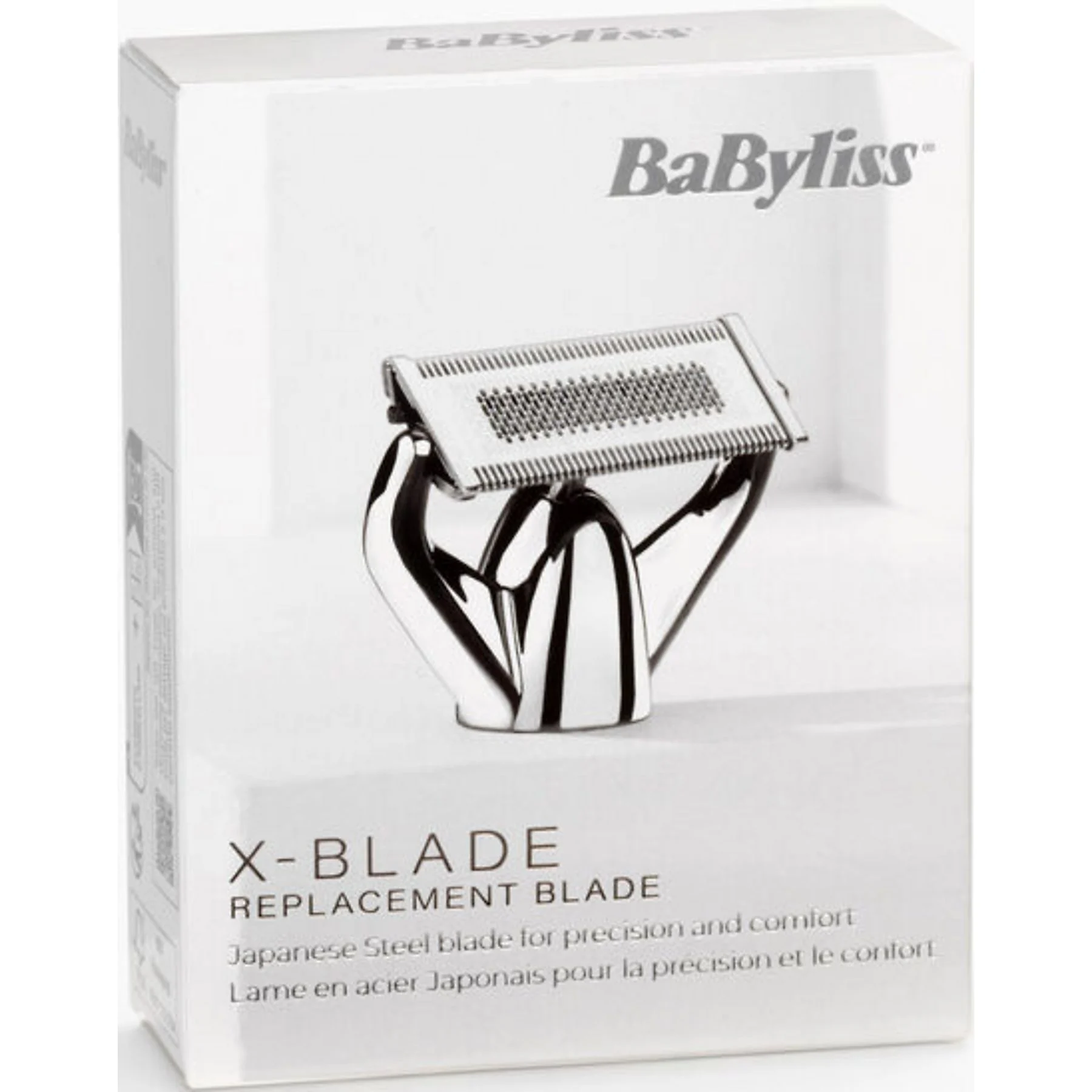 Egy BaByliss X-BLADE cserepenge, ezüst és fekete, egy fehér dobozban. A szöveg tartalmazza a 'REPLACEMENT BLADE' feliratot.