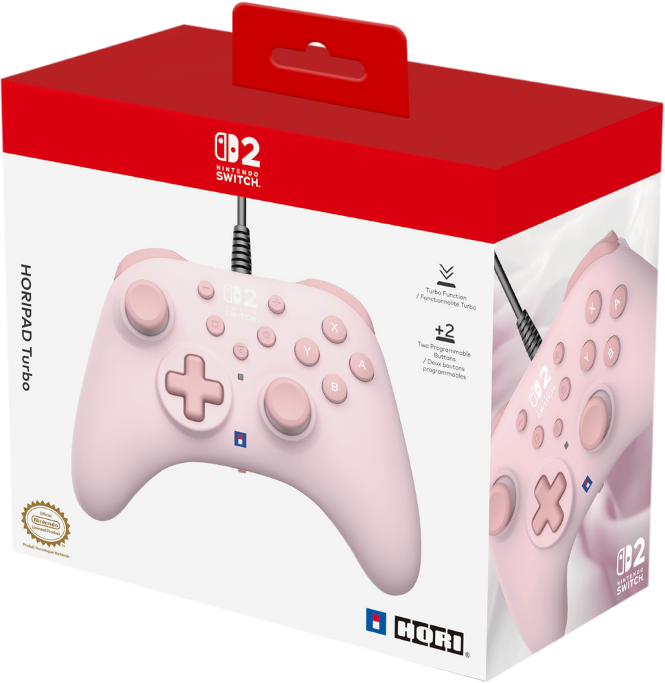 Une manette Nintendo Switch rose dans sa boîte. La boîte est blanche et rouge. La manette a des boutons et une croix directionnelle.