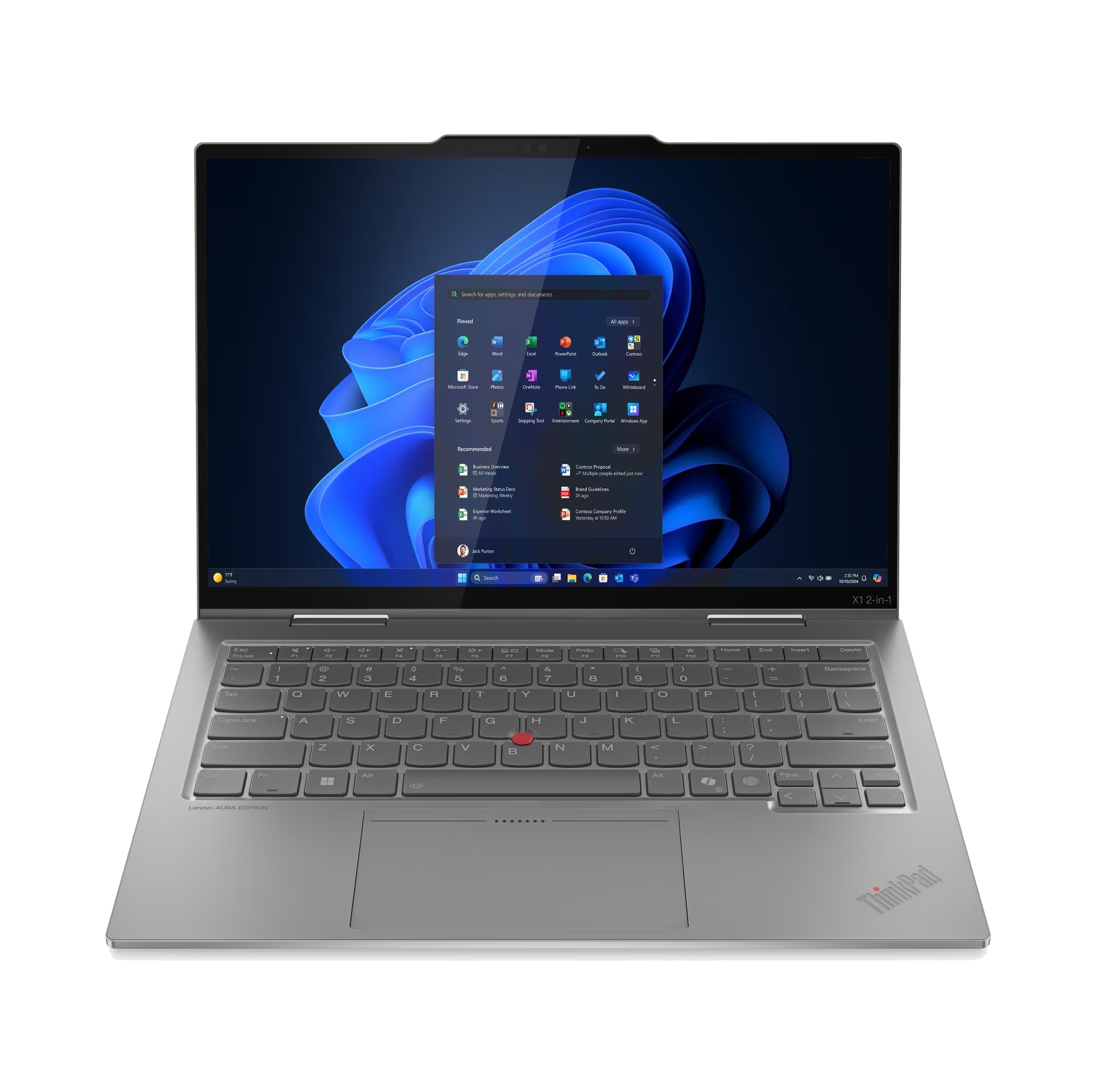 Un portátil plateado muestra una interfaz de Windows. El teclado es visible y la pantalla muestra iconos de aplicaciones.