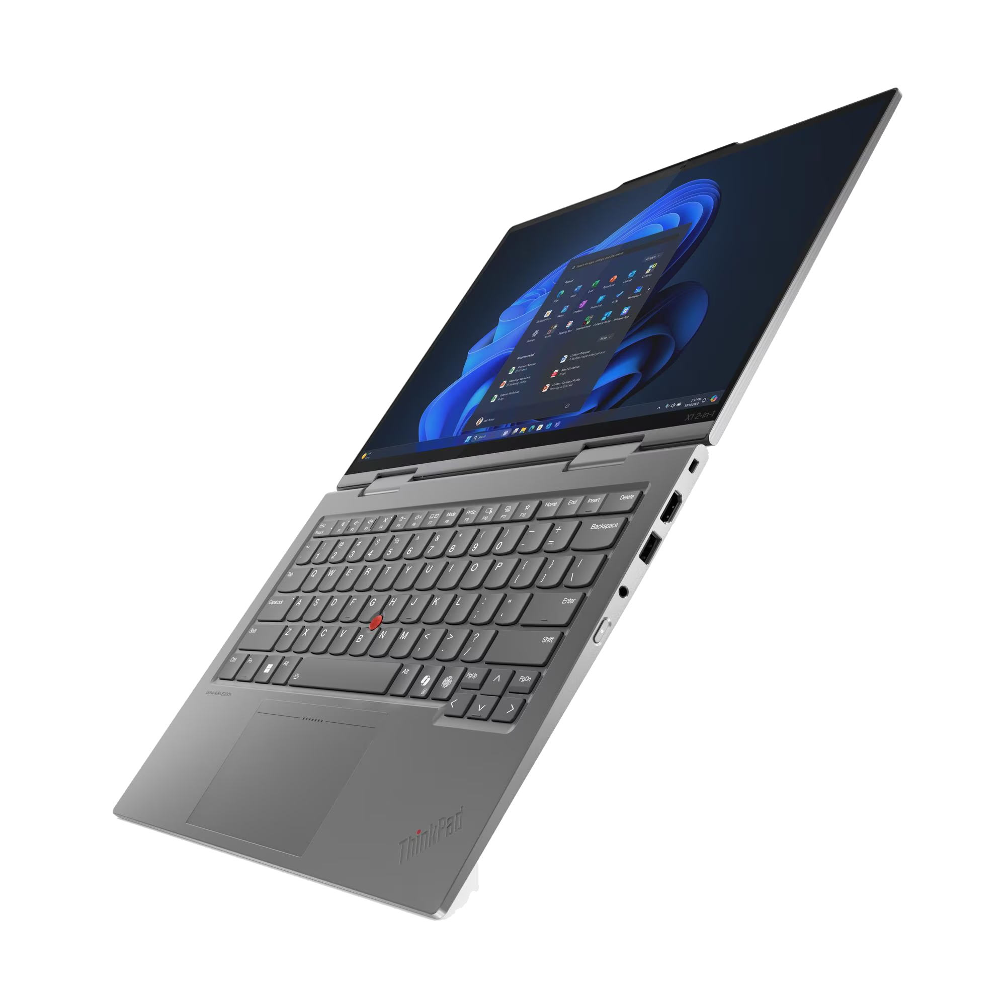Un portátil ThinkPad gris está abierto, mostrando el teclado y la pantalla con una interfaz de Windows, sobre un fondo negro.