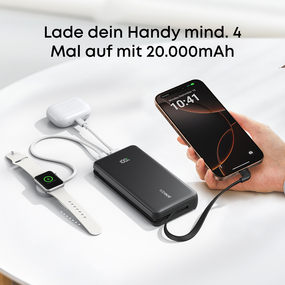 Eine schwarze Powerbank lädt ein Telefon, AirPods und eine Uhr auf. Text: Laden Sie Ihr Telefon mindestens 4 Mal mit 20.000 mAh auf.