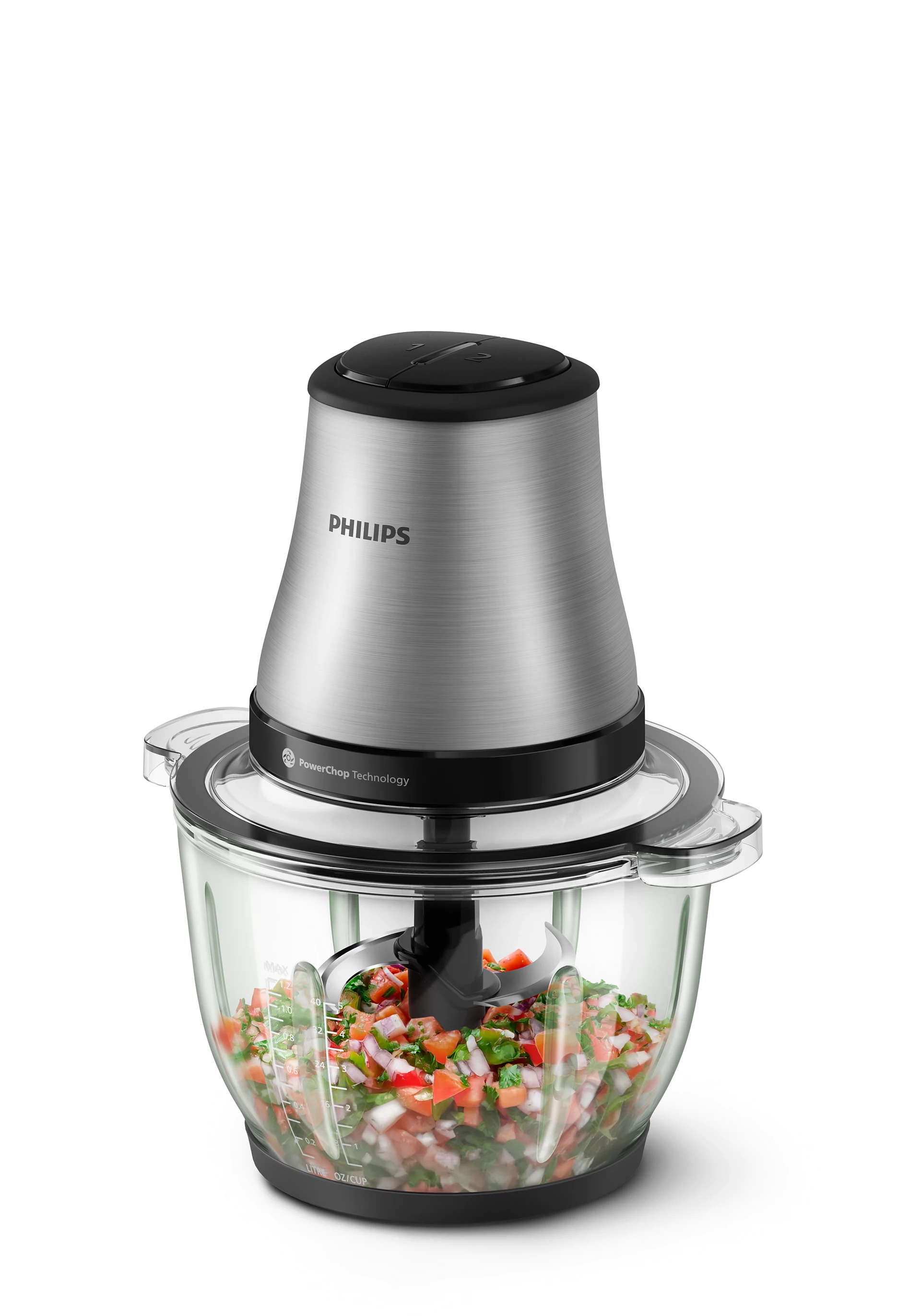 Un picador de alimentos Philips con verduras picadas. Tiene un motor plateado y un bol de cristal.