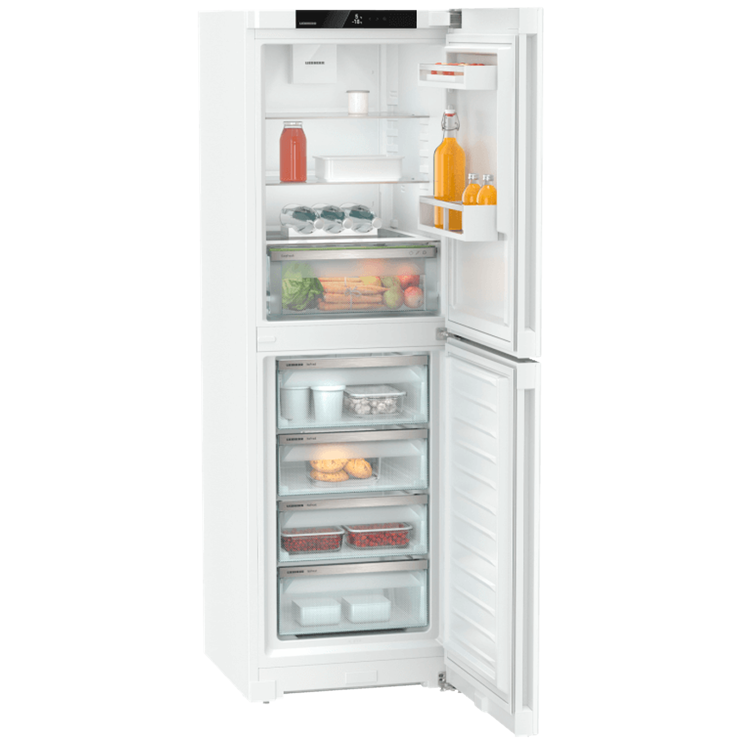 Open white refrigerator with various foods inside. Includes juice bottles, produce, and frozen items in drawers.