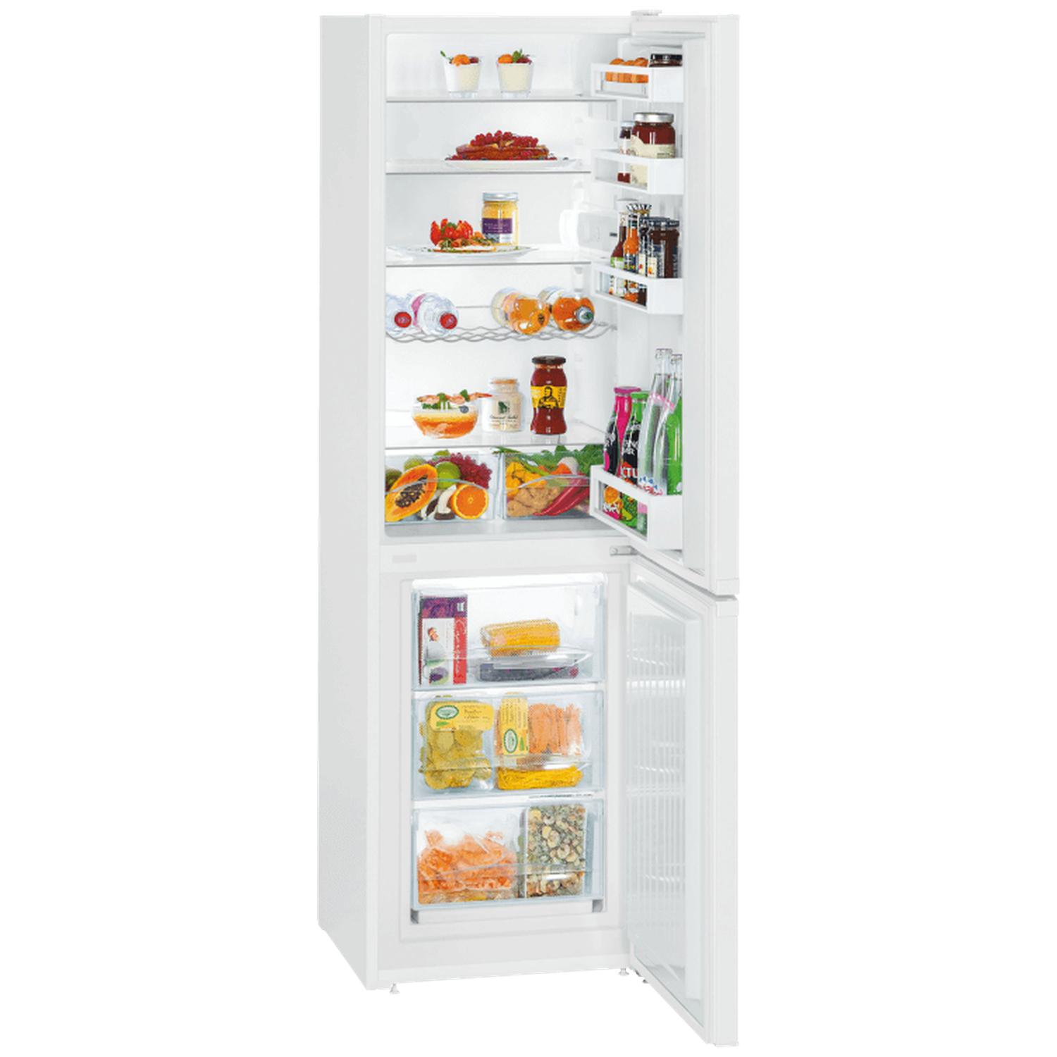 Open white refrigerator filled with food: fruits, yogurt, vegetables, bottles, and jars. The door is open.