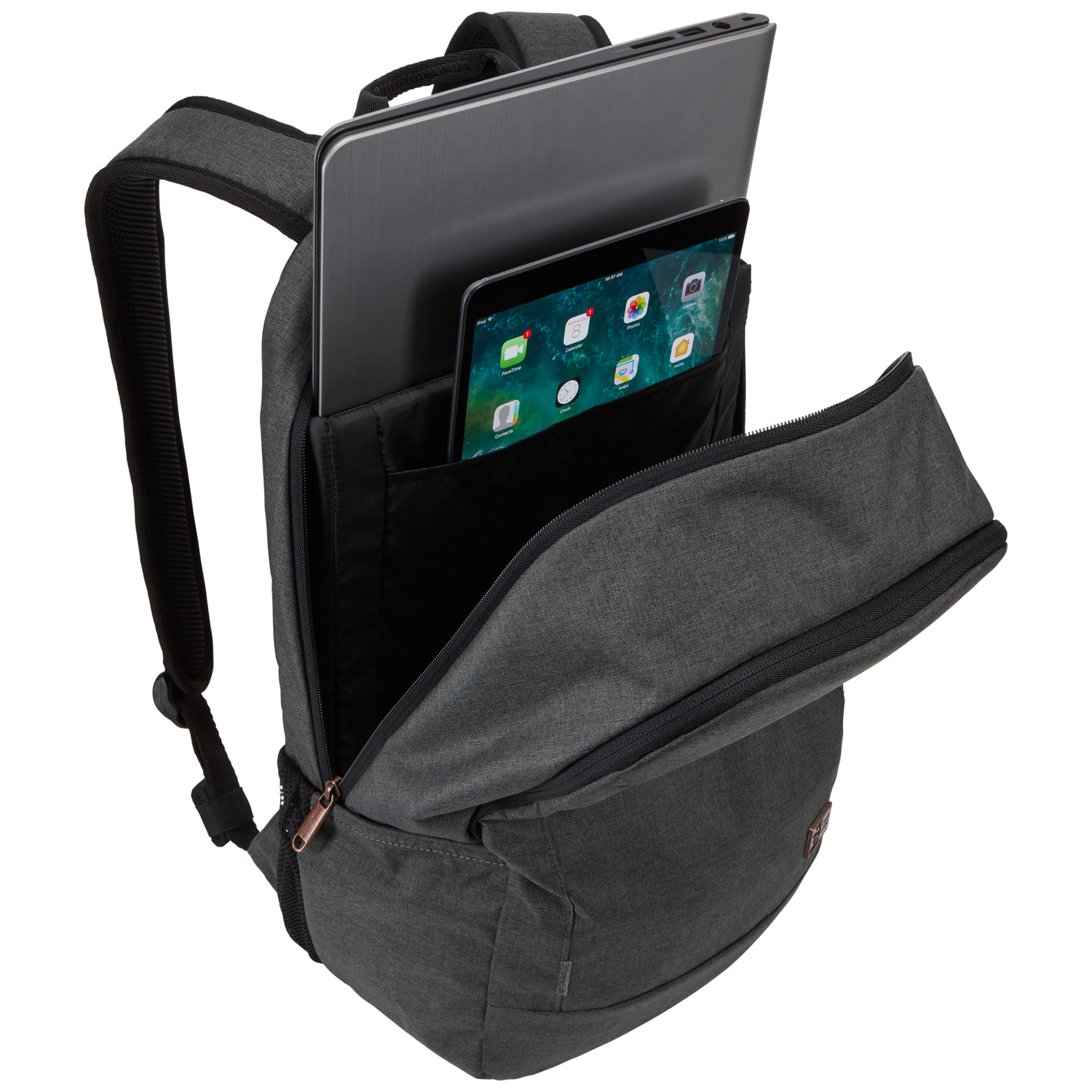 A gray backpack is open, revealing a laptop and a tablet. The backpack has black straps and a bronze zipper.