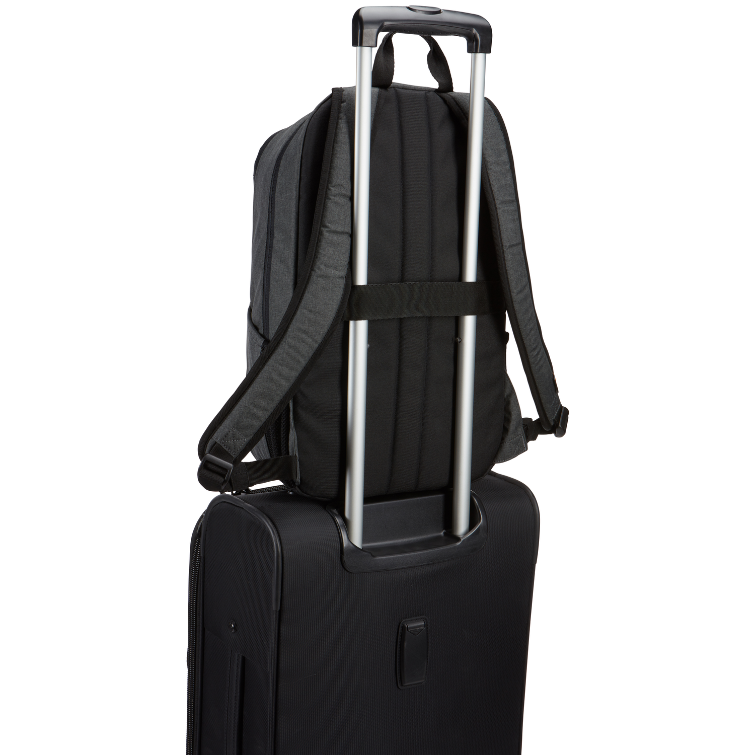 A black backpack rests on a black suitcase. The suitcase handle is extended. The background is white.