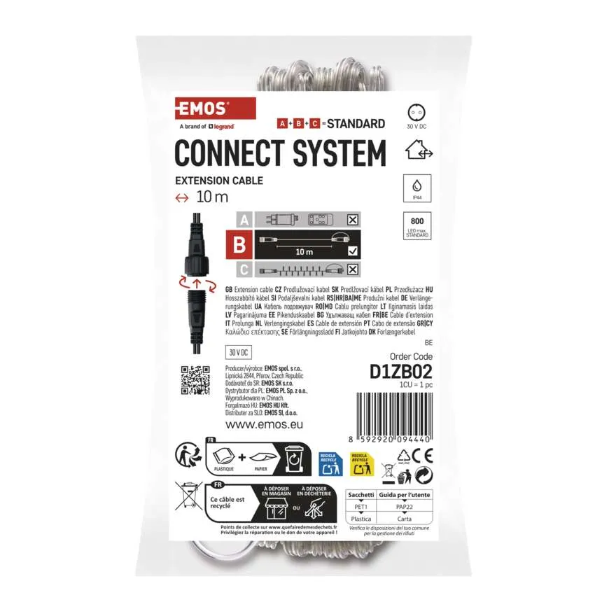Egy fehér műanyag zacskó egy fekete hosszabbítót mutat, 'CONNECT SYSTEM' és '10 m' felirattal.