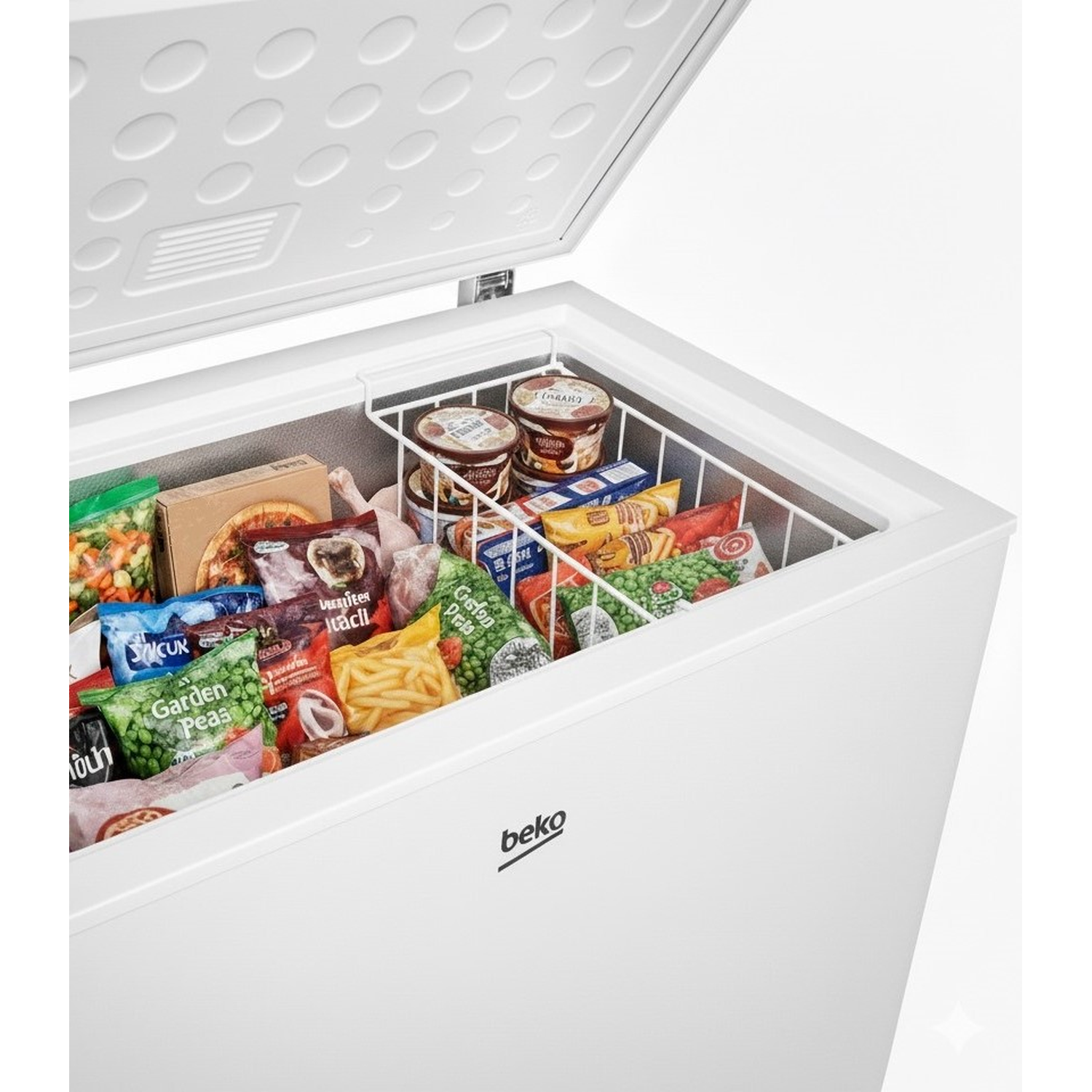 Open white freezer filled with frozen foods like vegetables, pizzas, and ice cream. Beko logo visible.