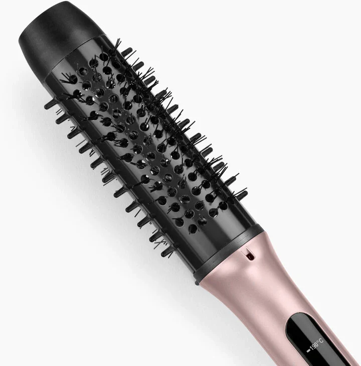 Una spazzola per capelli nera e oro rosa. Ha un fusto rotondo con setole e un display della temperatura.