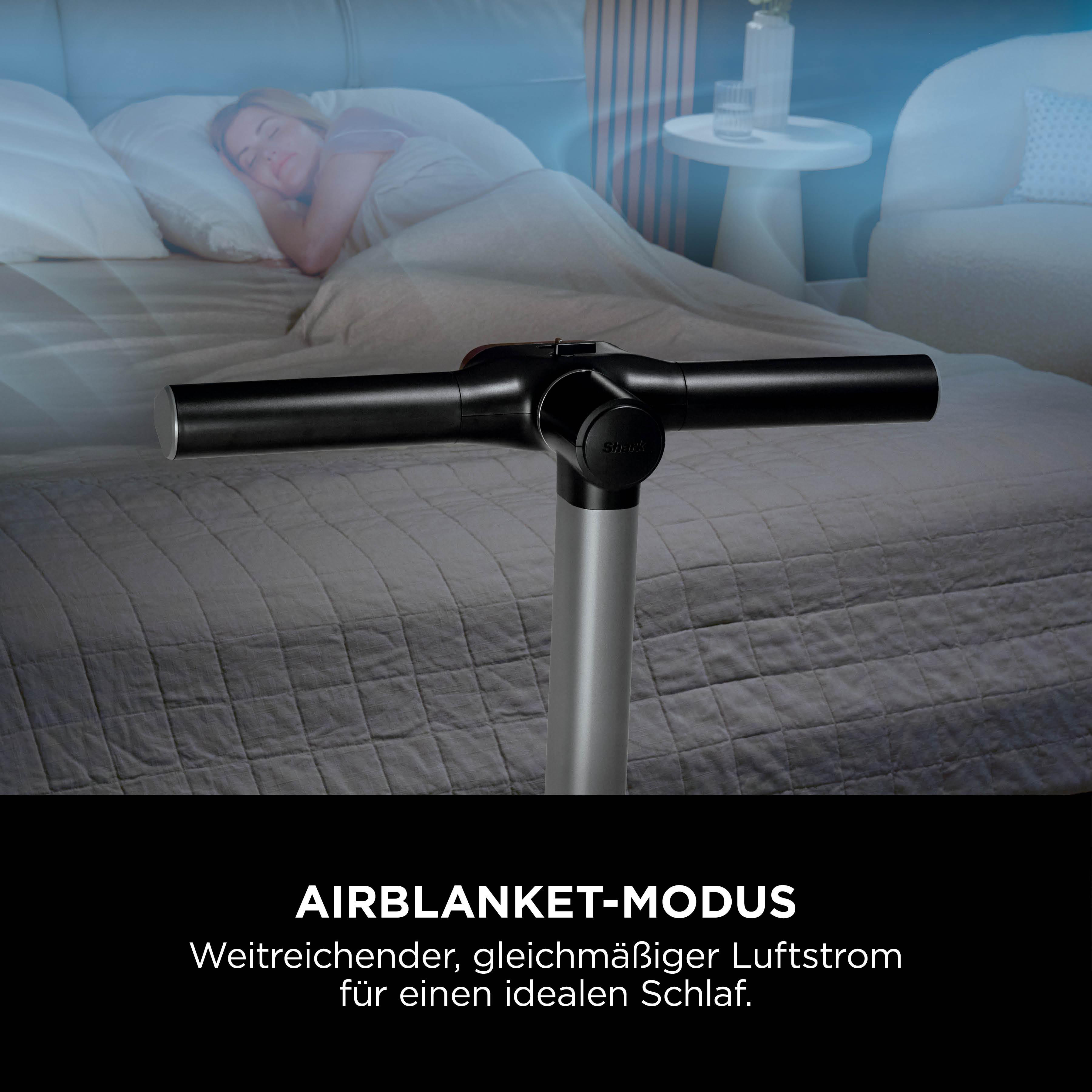Eine Frau schläft im Bett. Ein silbernes und schwarzes Gerät ist im Vordergrund. Text: AIRBLANKET-MODUS.