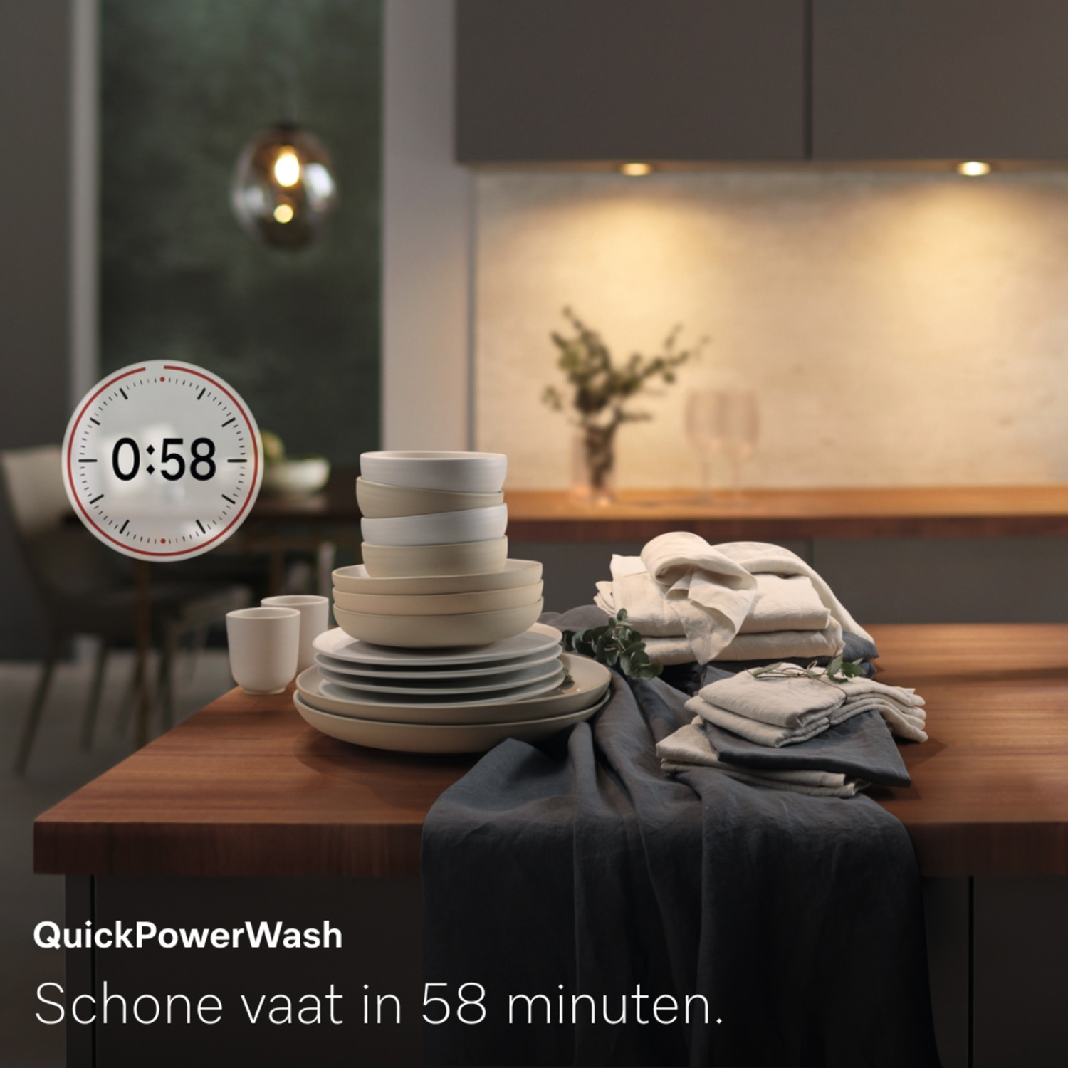A kitchen scene with clean dishes, towels, and a timer set to 0:58. Text reads 'QuickPowerWash' and 'Clean dishes in 58 minutes'.
