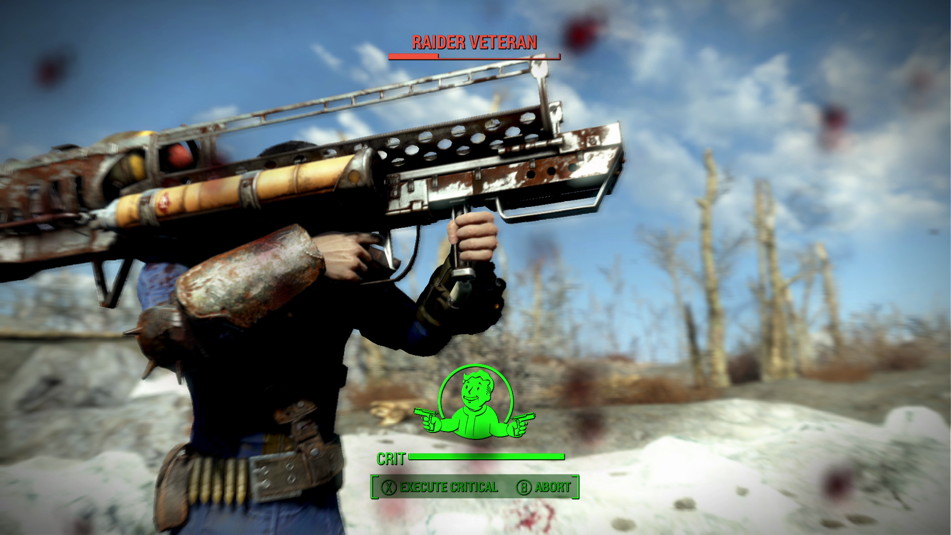 Une personne tient une grande arme rouillée. L'interface du jeu affiche 'Raider Veteran' et 'Crit'. L'arrière-plan est un désert.