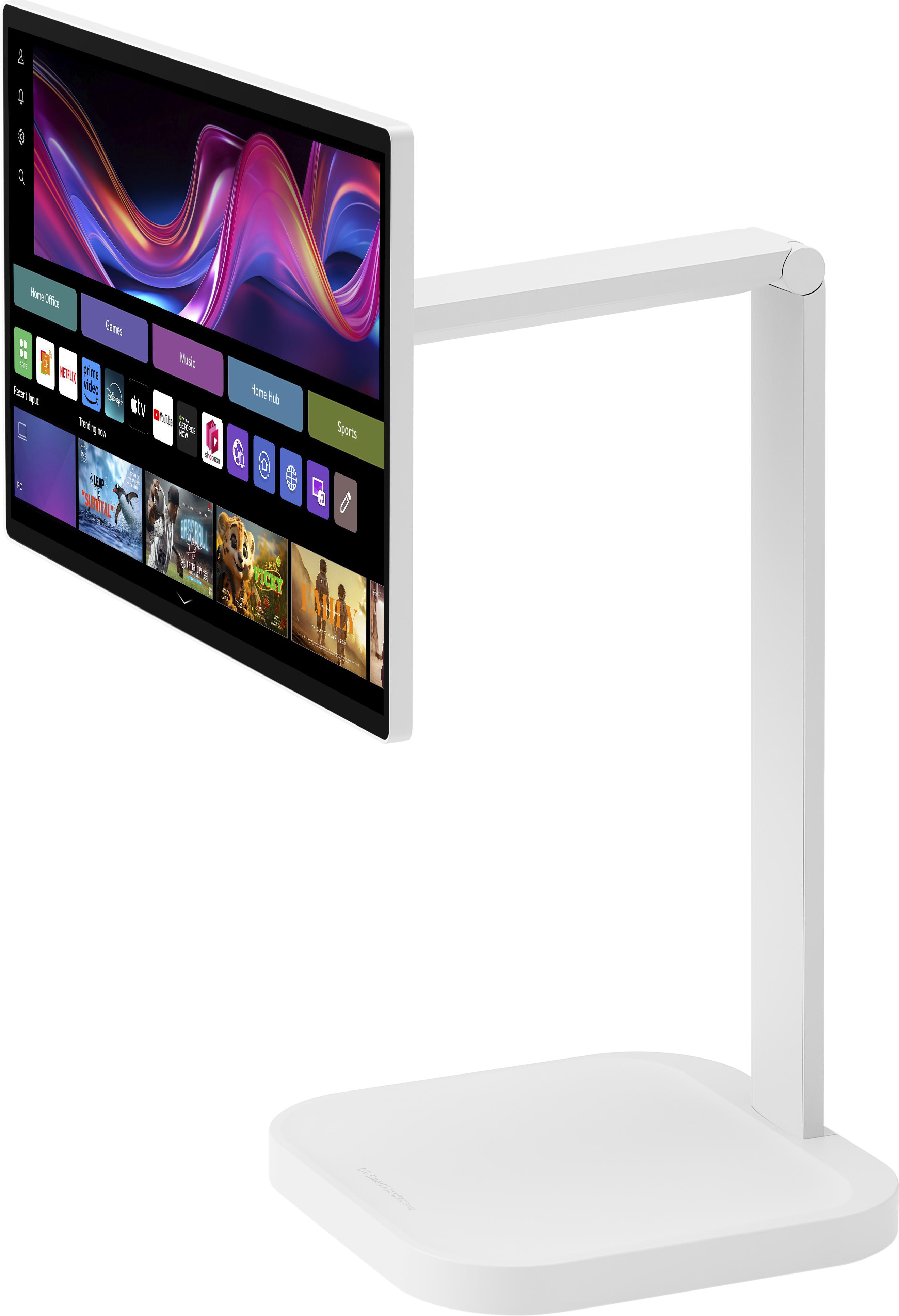 Ein weißer Monitor auf einem weißen Ständer. Der Bildschirm zeigt Apps und Trendshows mit farbenfrohem Hintergrund.