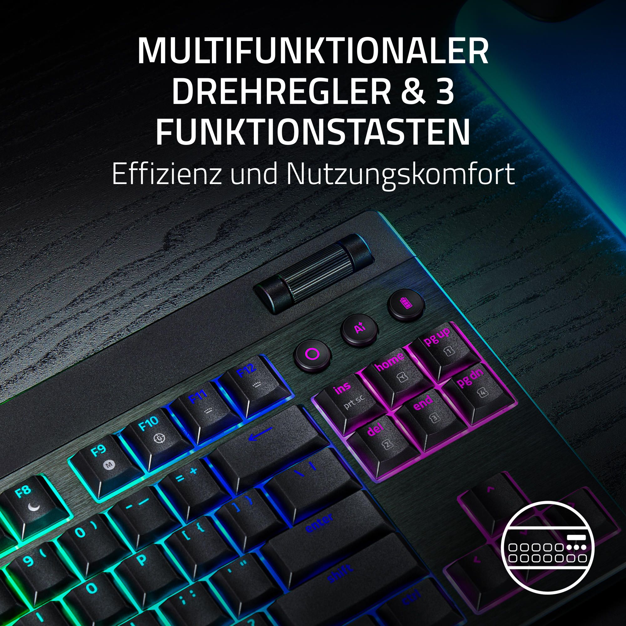 Nahaufnahme einer schwarzen Tastatur mit beleuchteten Tasten. Sie hat einen Drehregler und Funktionstasten. Die Tasten sind blau, grün und lila.