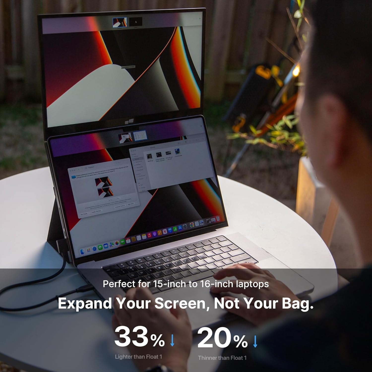 A person uses a laptop with an attached secondary screen. Text reads: Expand Your Screen, Not Your Bag. Stats: 33% lighter, 20% thinner.