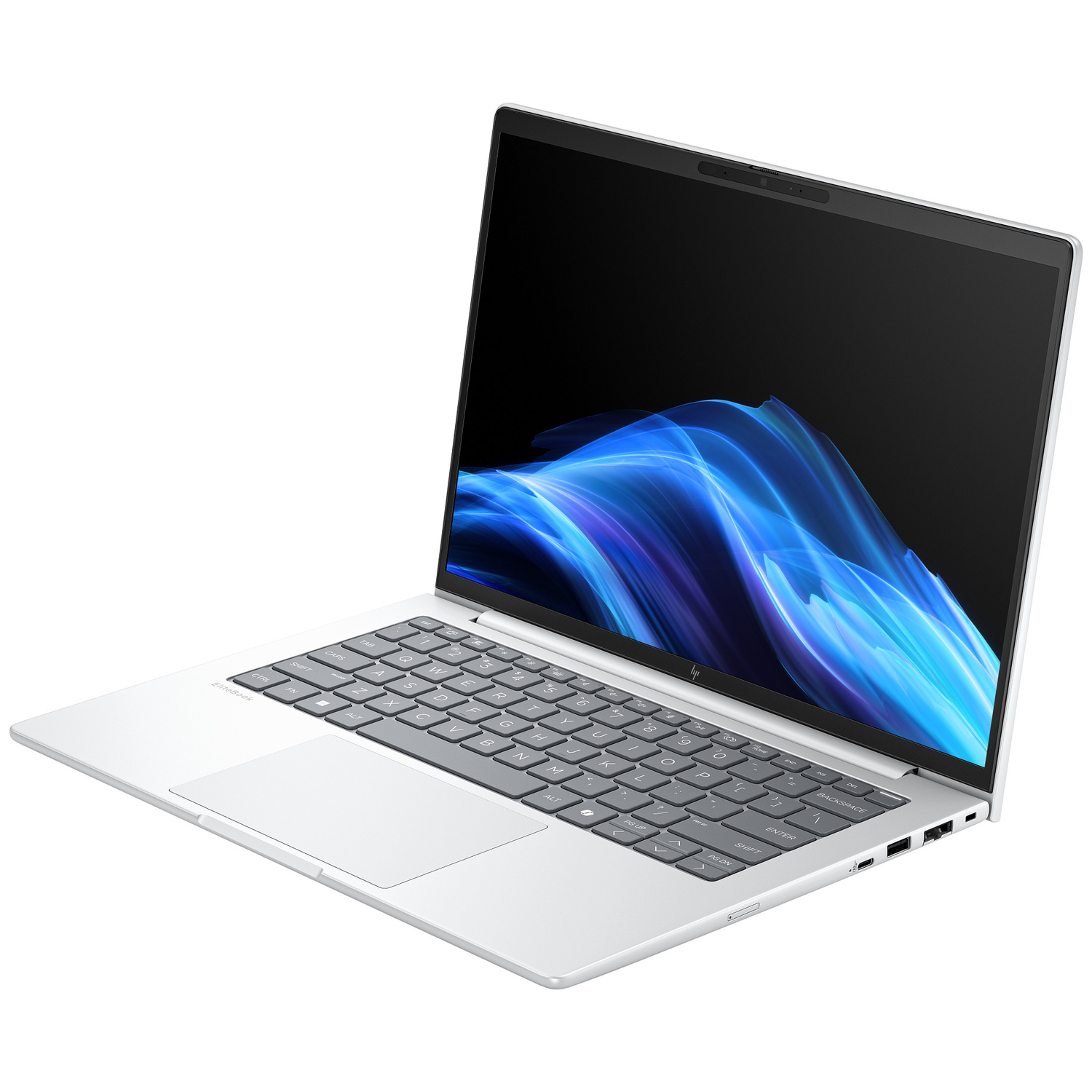 A silver laptop is open. The screen displays blue and white abstract shapes. The keyboard and touchpad are visible.