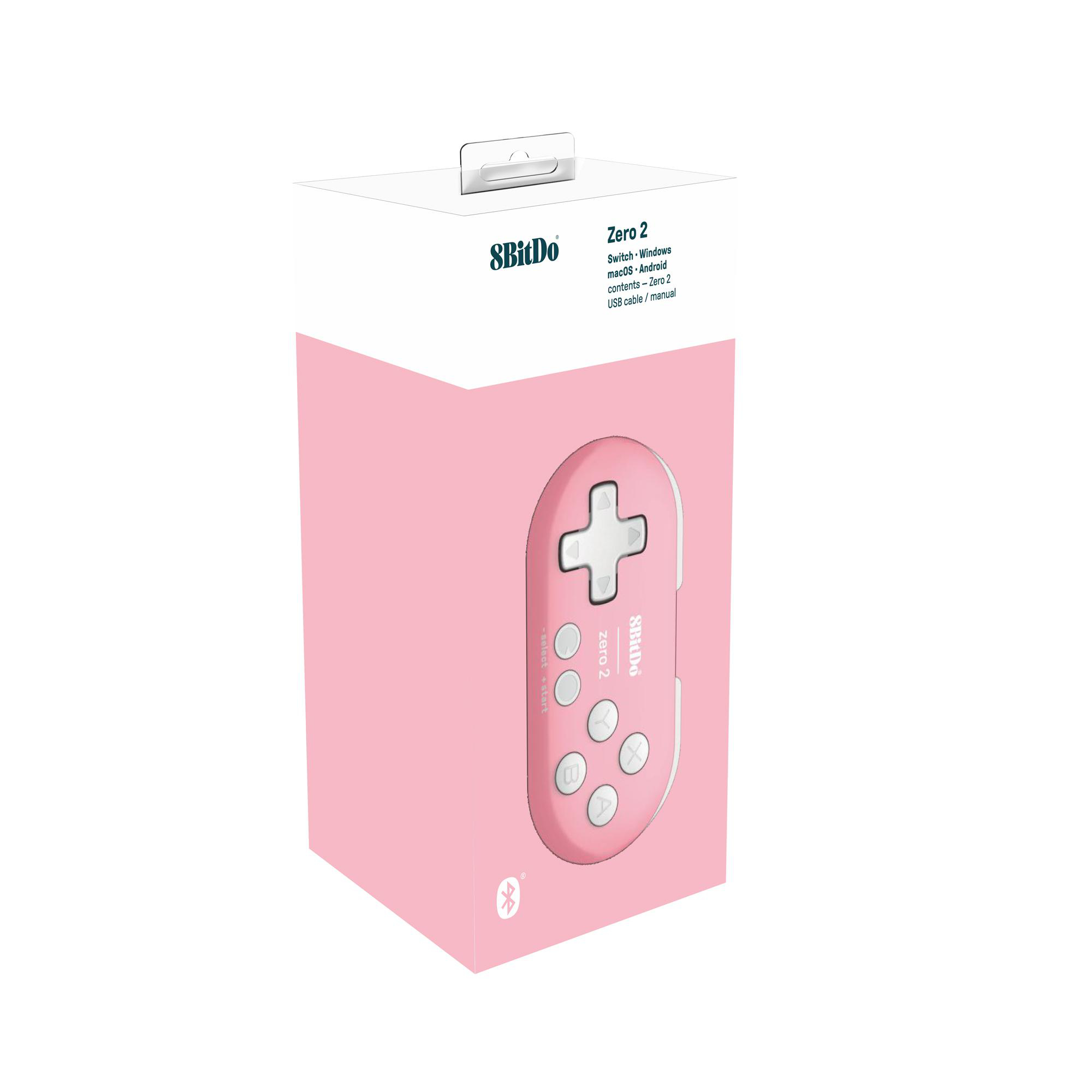Pinke 8BitDo Zero 2 Gamecontroller-Box. Enthält Controller, Kabel und Handbuch. Der Controller ist pink.