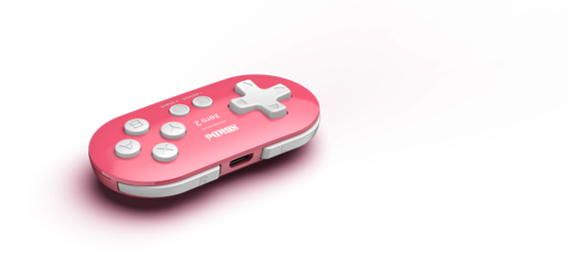 Ein pinkfarbener und weißer Gamecontroller auf weißem Hintergrund. Er hat Knöpfe und ein Steuerkreuz. Der Markenname ist sichtbar.