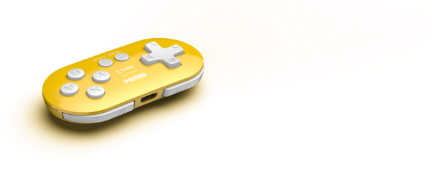 Ein gelb-weißer Handheld-Gamecontroller auf weißem Hintergrund. Es hat Knöpfe und ein Steuerkreuz.