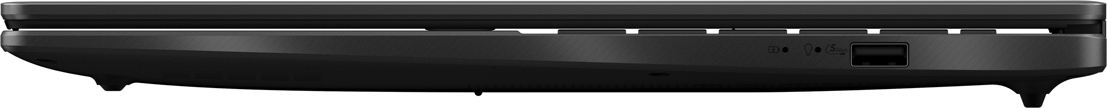 Vue latérale d'un ordinateur portable noir. Les ports visibles incluent USB, prise casque et autres marquages.
