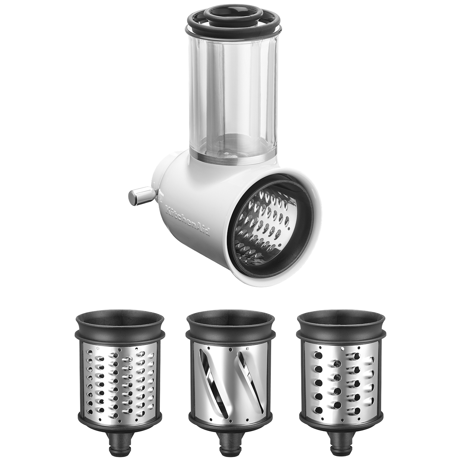 A KitchenAid food processor attachment. It has a white body, clear container, and three different stainless steel shredding/slicing drums.