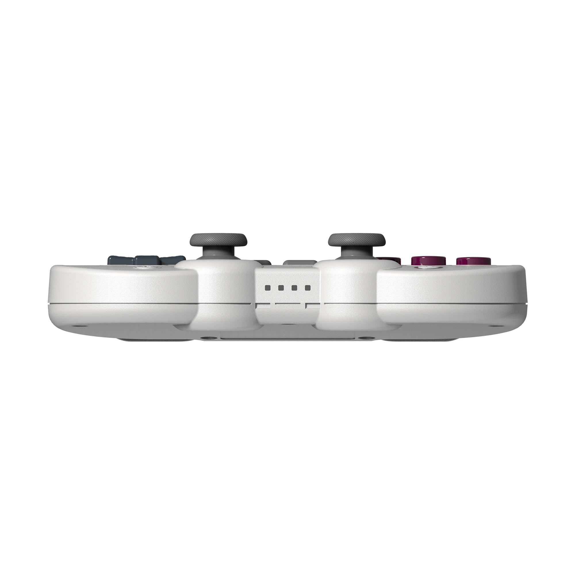 Seitenansicht eines weißen Gamecontrollers mit grauen Joysticks und lila Knöpfen vor weißem Hintergrund.