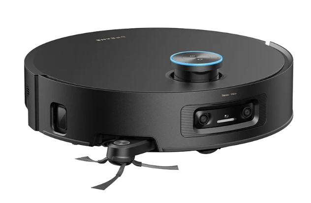 Czarny robot odkurzający. Ma okrągły kształt z centralnym panelem sterowania i szczotkami czyszczącymi z przodu.