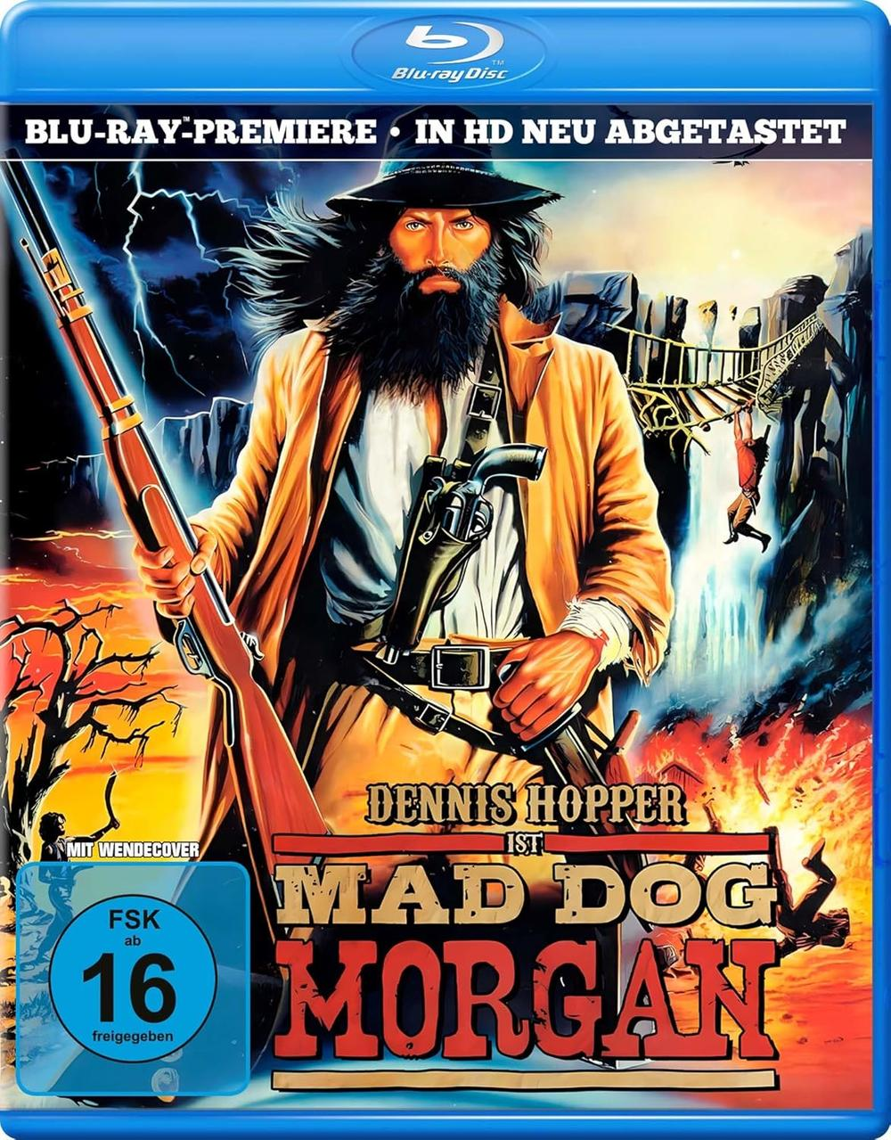Blu-ray-Cover für Mad Dog Morgan. Es zeigt Dennis Hopper mit einer Waffe, einem Bart und einem Hut. Der Hintergrund zeigt eine Brücke.