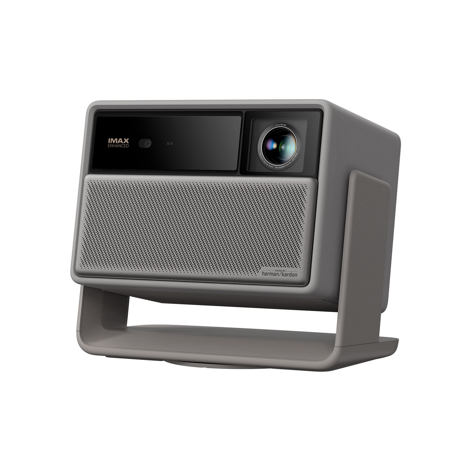 Un proyector gris con altavoz, cámara y soporte. El frontal tiene las etiquetas 'IMAX Enhanced' y 'Harman Kardon', sobre fondo blanco.
