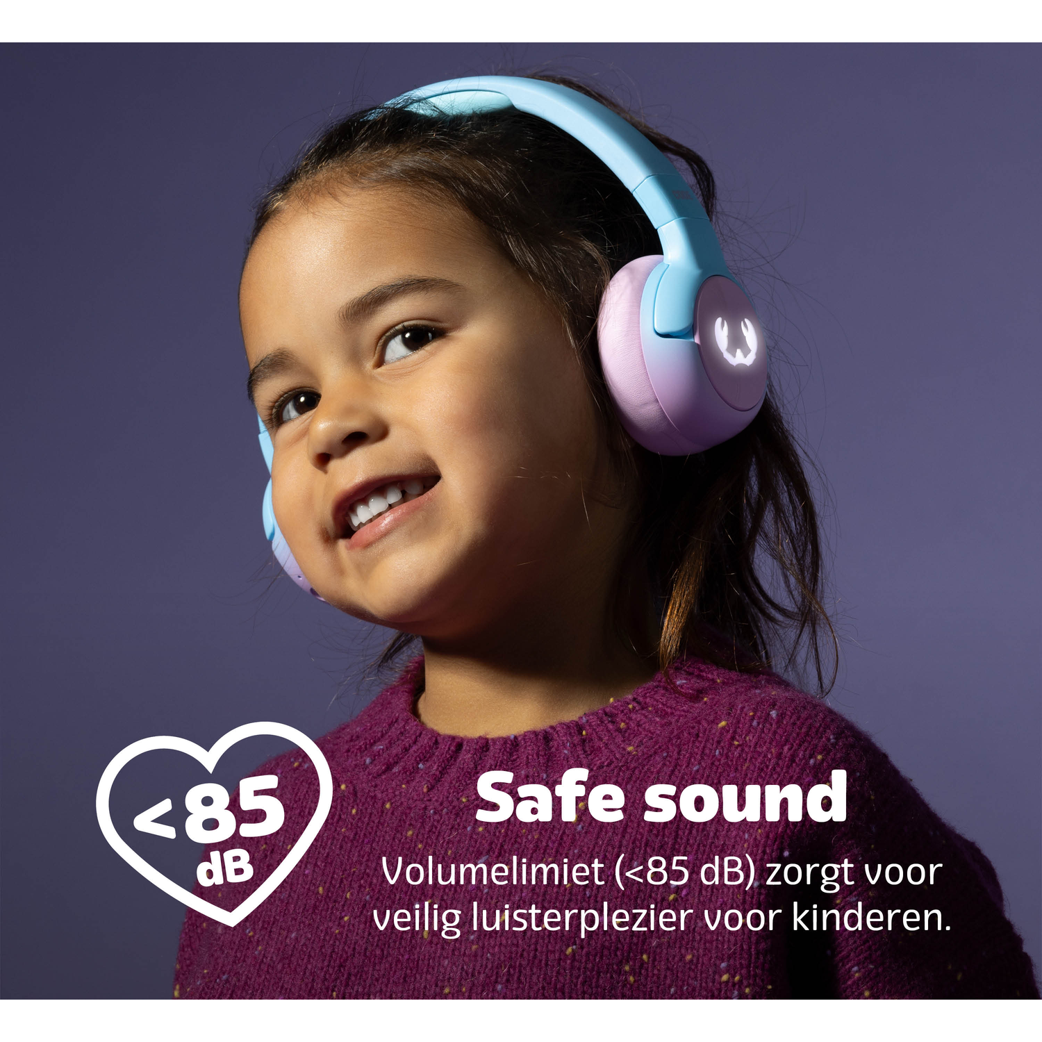 A smiling girl wearing blue and pink headphones. Text says 'Safe sound' with a heart icon and '<lt/>85 dB'. Purple background.