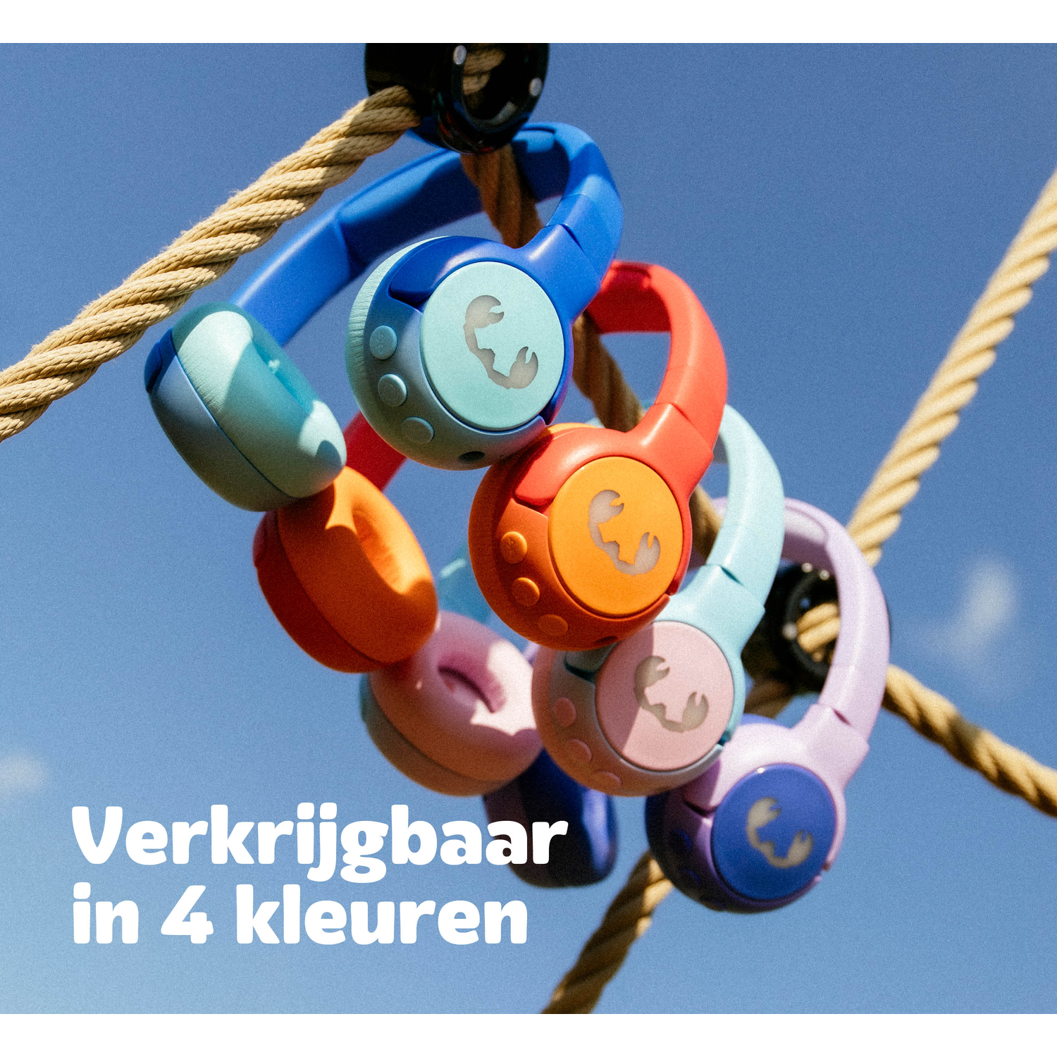 Colorful headphones in blue, orange, pink, and purple are hanging from a rope against a blue sky. Text: Available in 4 colors.