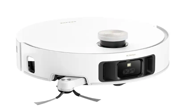 Biały robot odkurzający ze srebrnym wierzchem. Posiada czarny obszar czujnika i dwie szczotki. Widoczna jest nazwa marki.