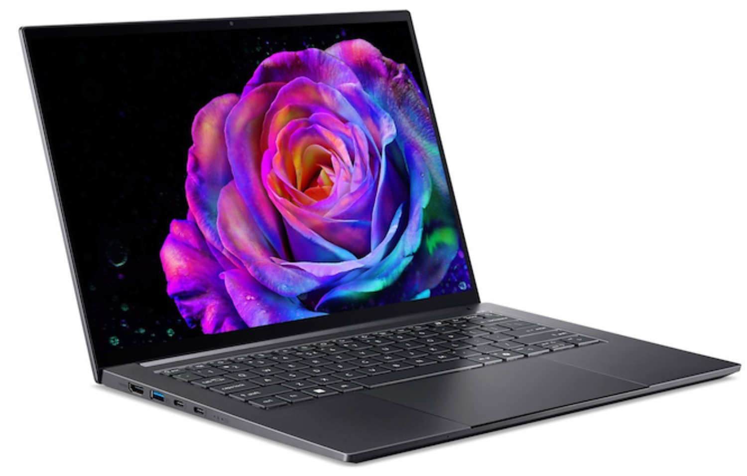 Ordenador portátil con una imagen de rosa vibrante en la pantalla. El teclado es visible. El fondo es negro.