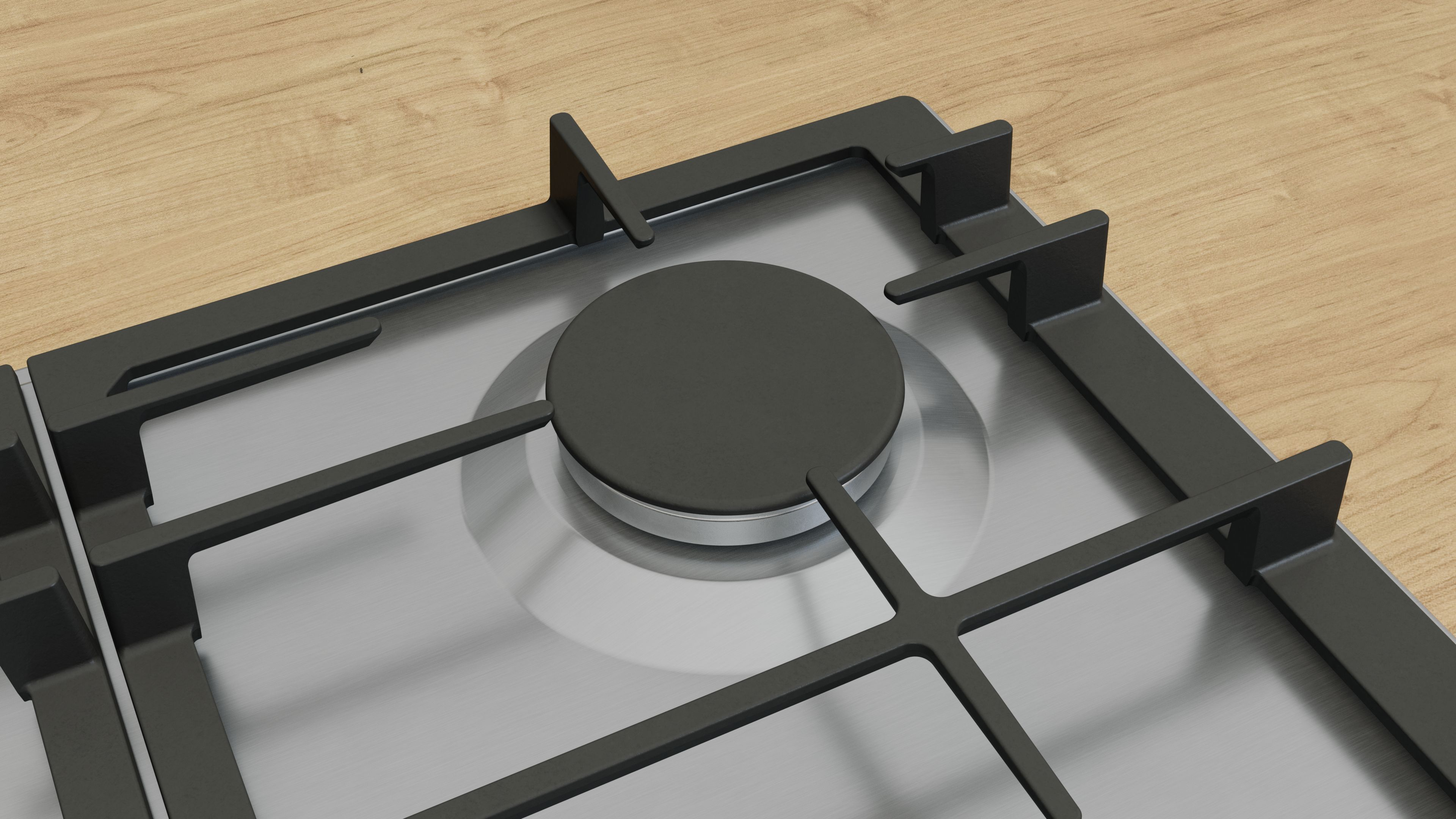 Primer plano de una cocina de gas. Un quemador negro está en el centro. Se ven rejillas negras y superficie plateada. Fondo de madera.