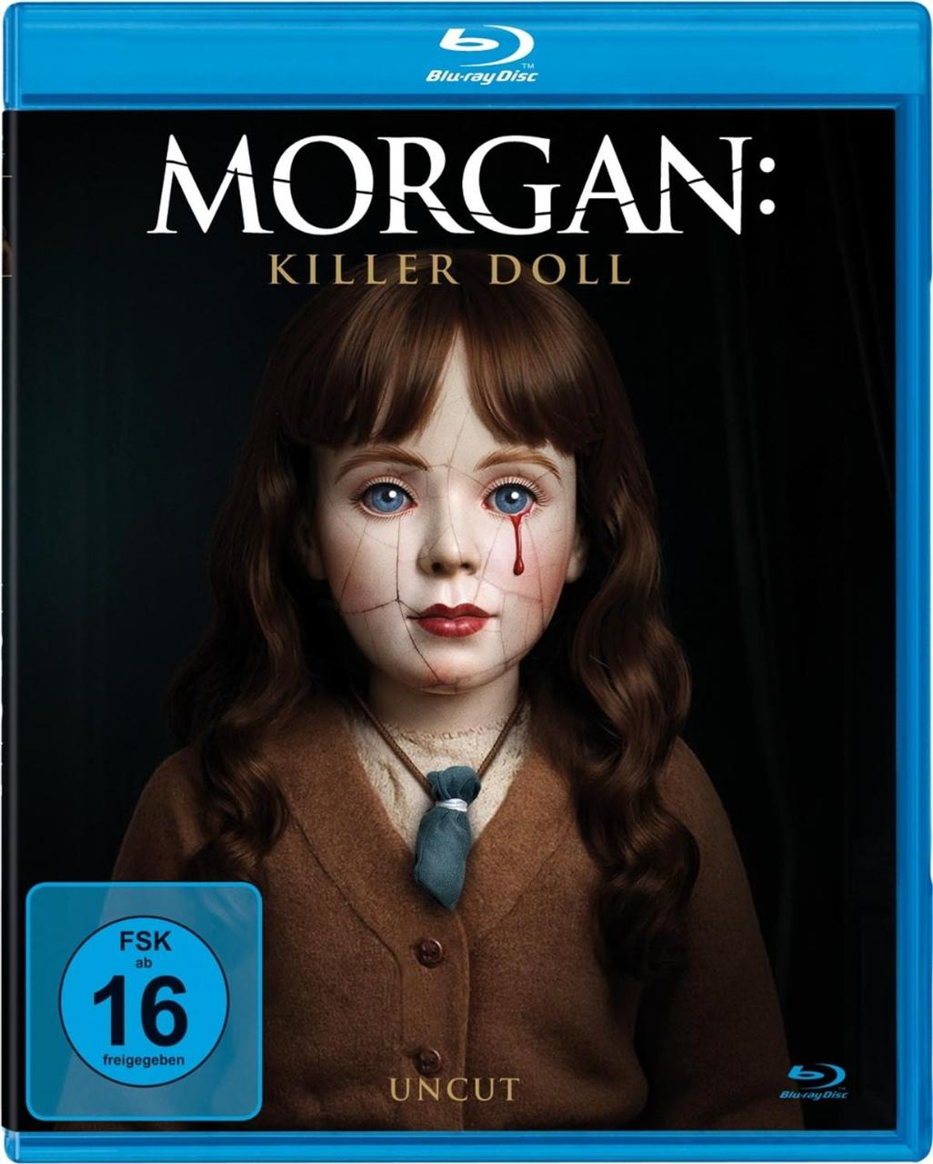 Blu-ray-Cover für „Morgan: Killer Doll“. Eine Puppe mit rissigem Gesicht, Träne und braunem Mantel ist zentriert. Blu-ray- und FSK-Logos sind vorhanden.