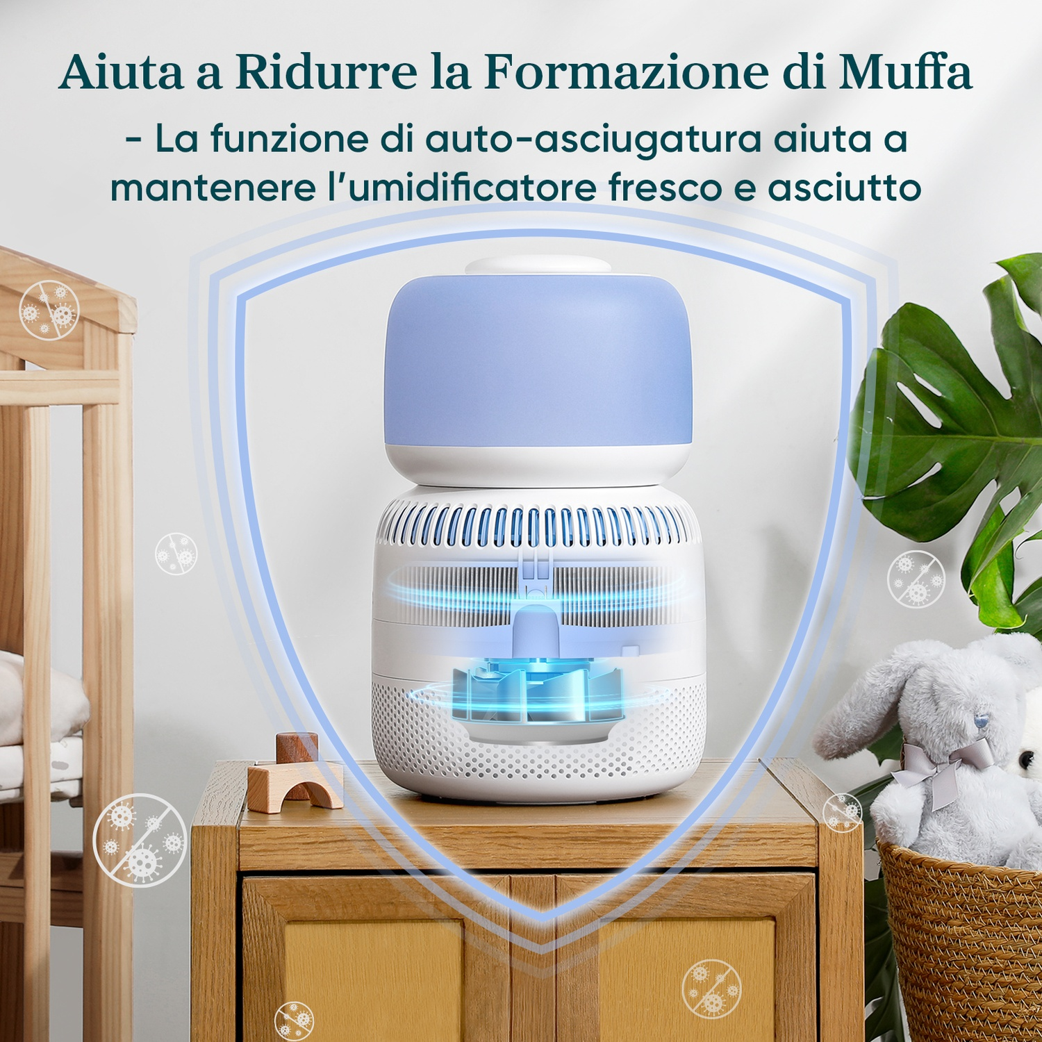 Umidificatore bianco e blu su un mobile in legno. Orsacchiotto e pianta sullo sfondo.