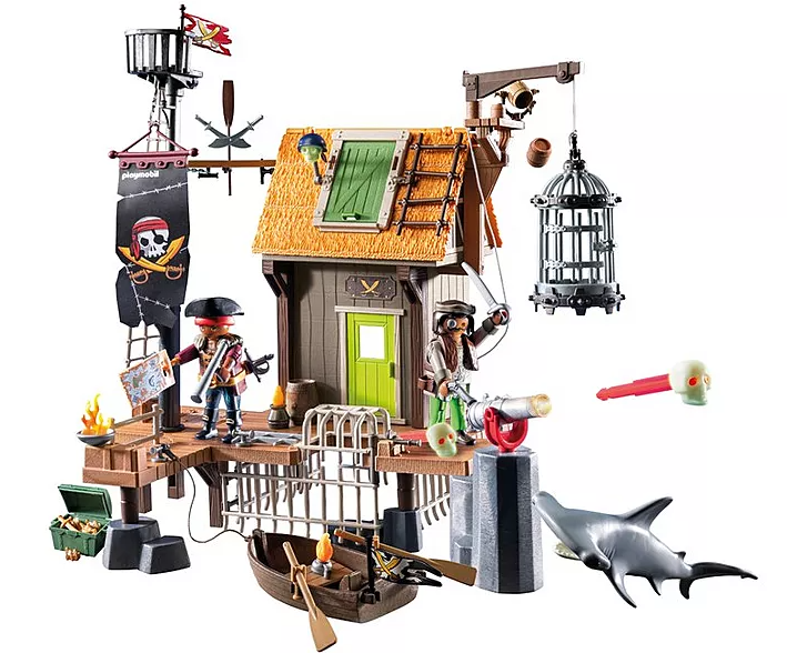 Ein Piratenschiff-Spielzeugset. Es enthält eine Holzkonstruktion mit Piraten, ein Boot, einen Hai, eine Kanone und einen Käfig.