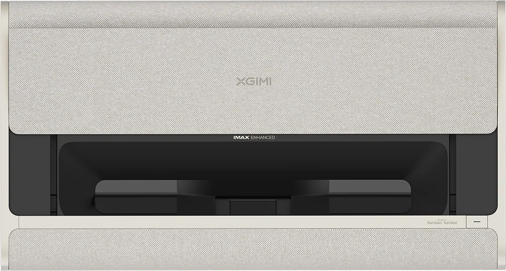 Un projecteur crème avec une housse en tissu. La marque XGIMI est visible. Possède les logos IMAX enhanced et harman kardon.