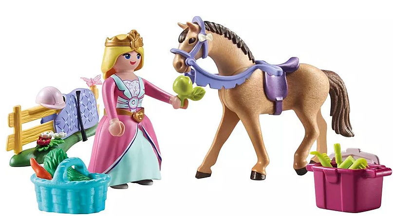 Eine Prinzessinnenfigur bietet einem Pferd einen grünen Gegenstand an. Zubehör umfasst einen Korb mit Gemüse, einen Zaun und Pflegeutensilien.