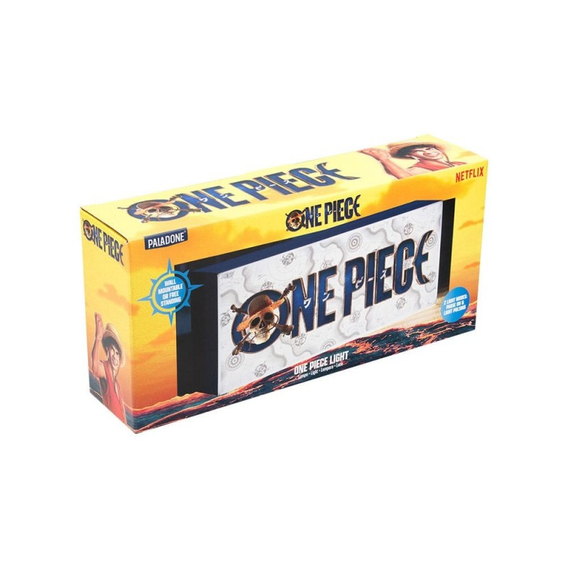 Una caja de luz 'One Piece'. La caja tiene imágenes de Luffy, una calavera y huesos cruzados y el logo de 'One Piece'. Es amarilla y blanca.